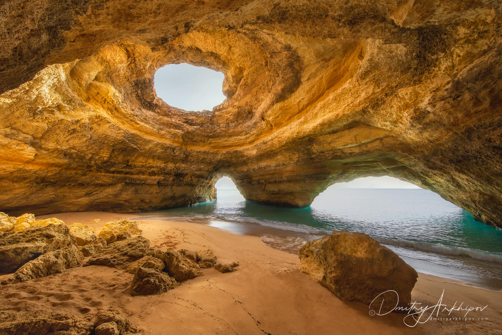 A historic tram traveling through the narrow, hilly streets of Lisbon, Portugal.